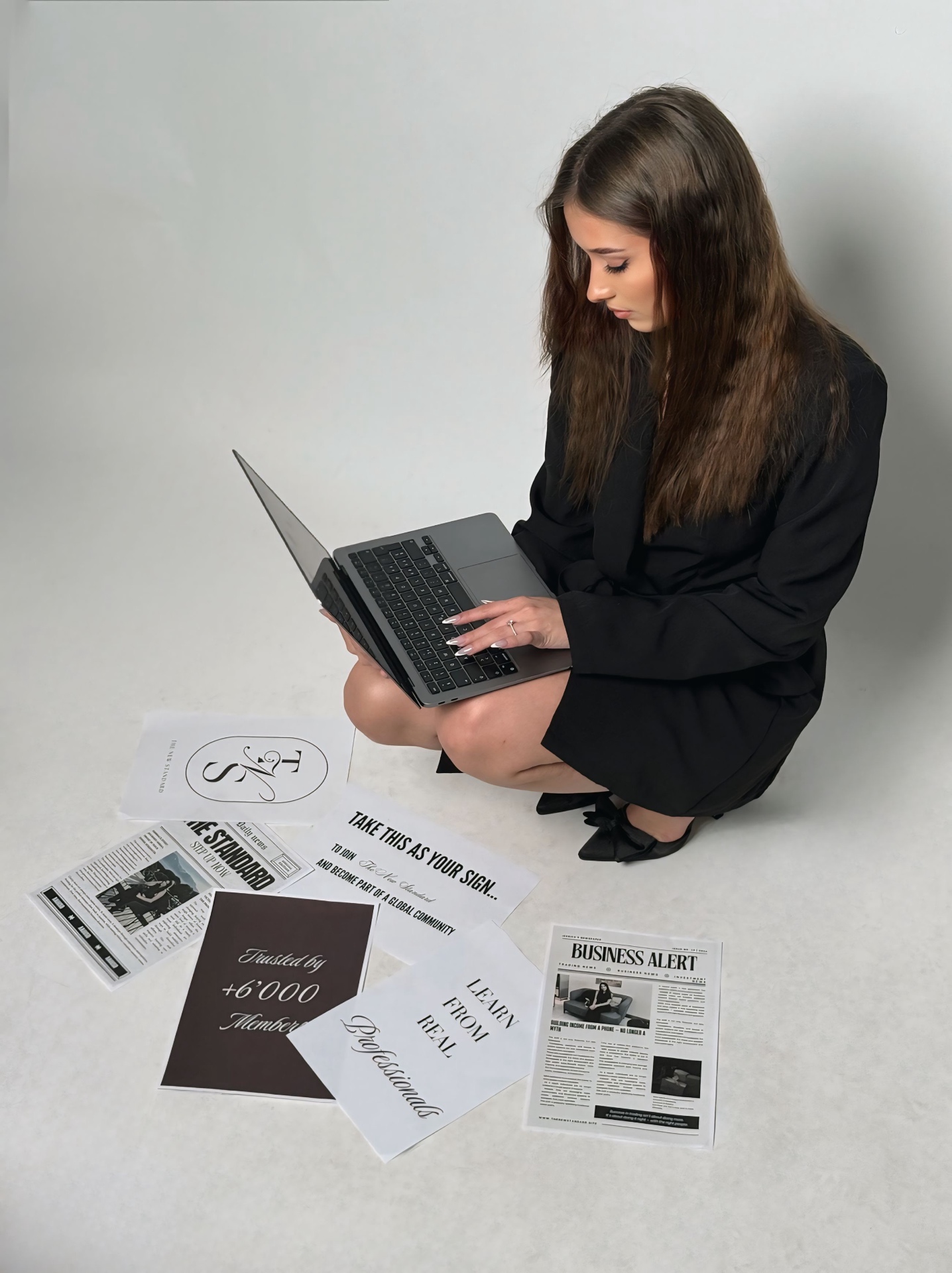 Jessica with laptop and brand materials